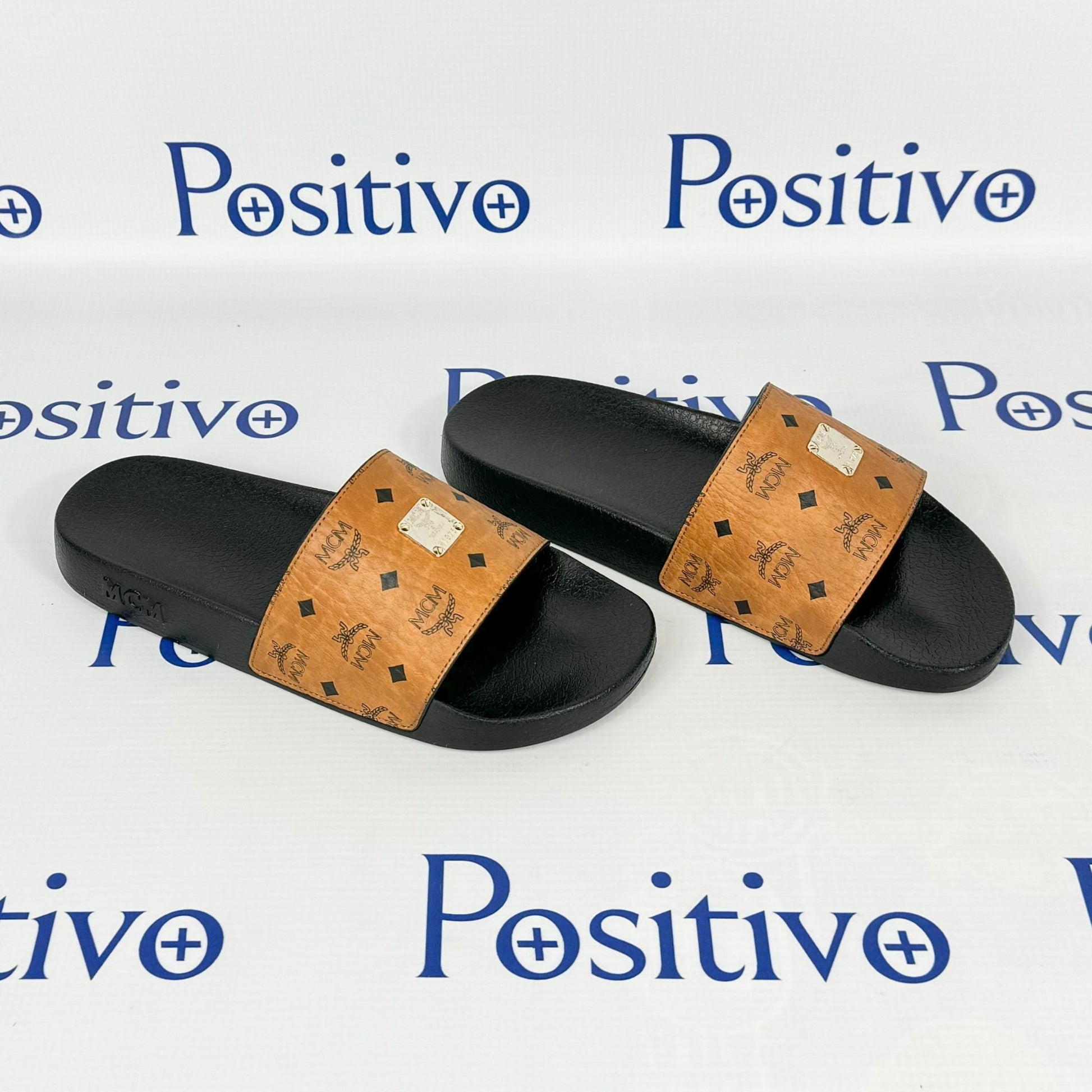 MCM Womens Cognac Visetos Rubber Slides | Positivo Clothing