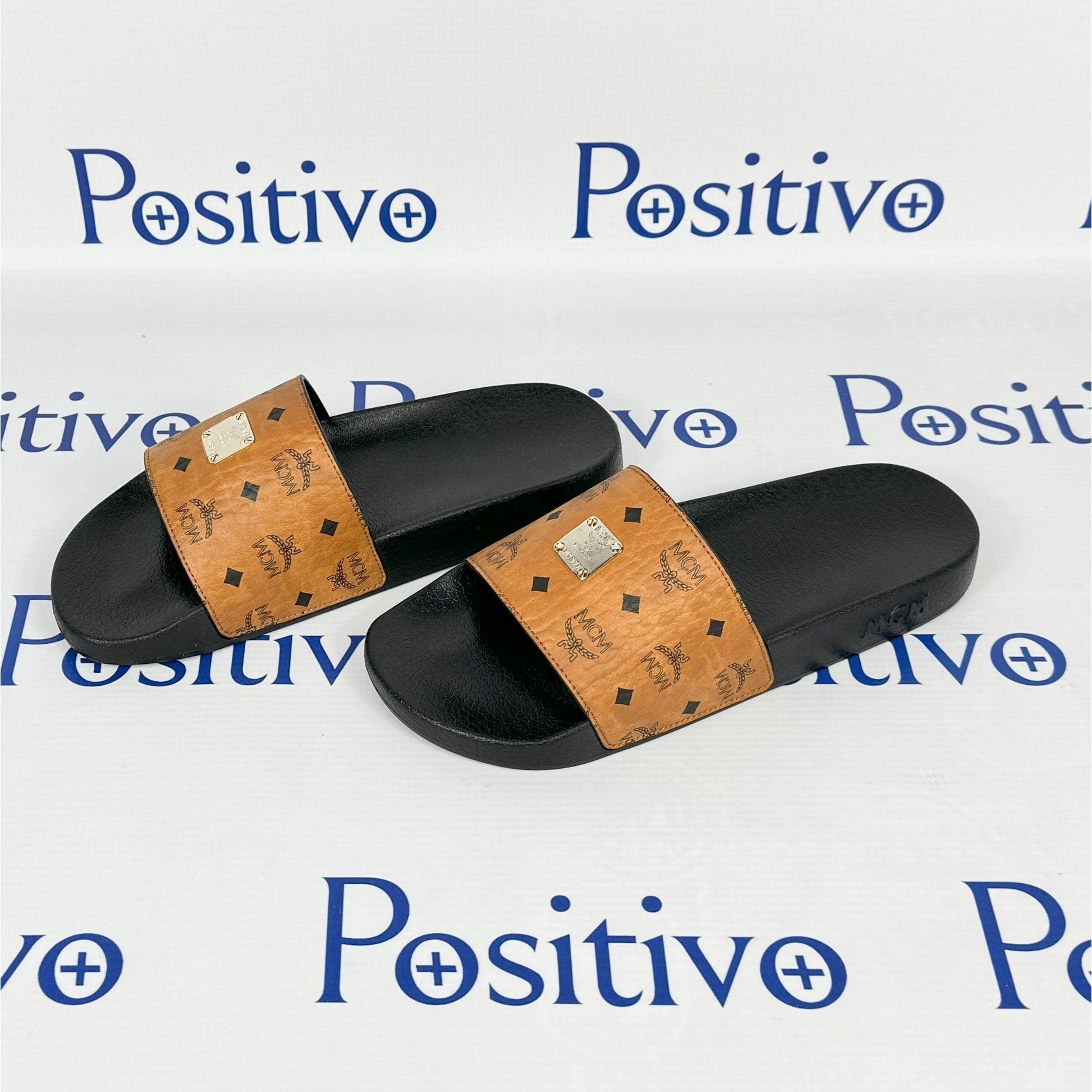 MCM Womens Cognac Visetos Rubber Slides | Positivo Clothing