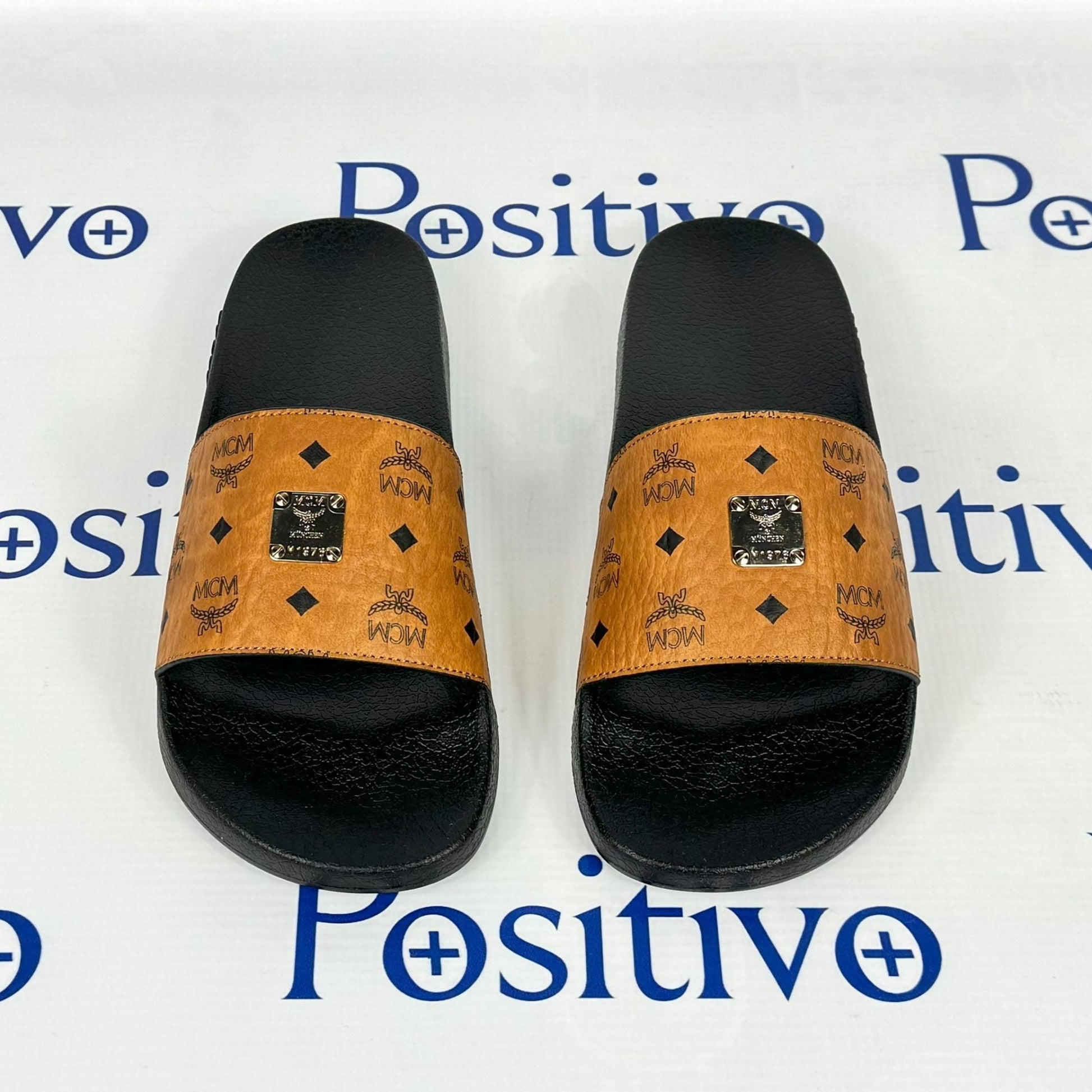 MCM Womens Cognac Visetos Rubber Slides | Positivo Clothing