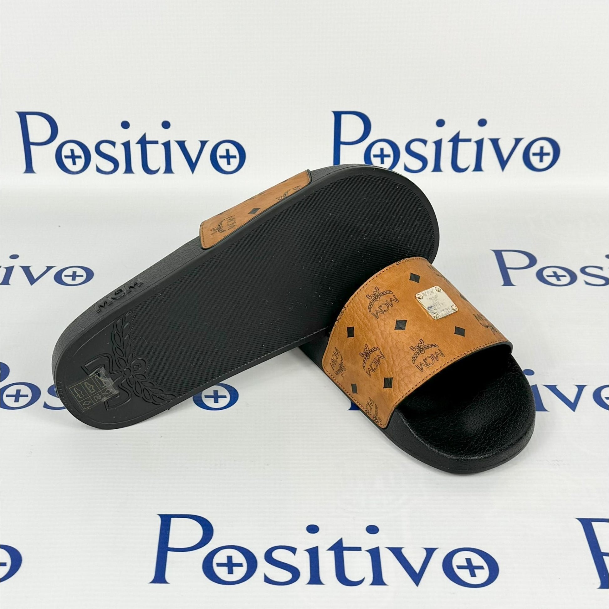 MCM Womens Cognac Visetos Rubber Slides | Positivo Clothing