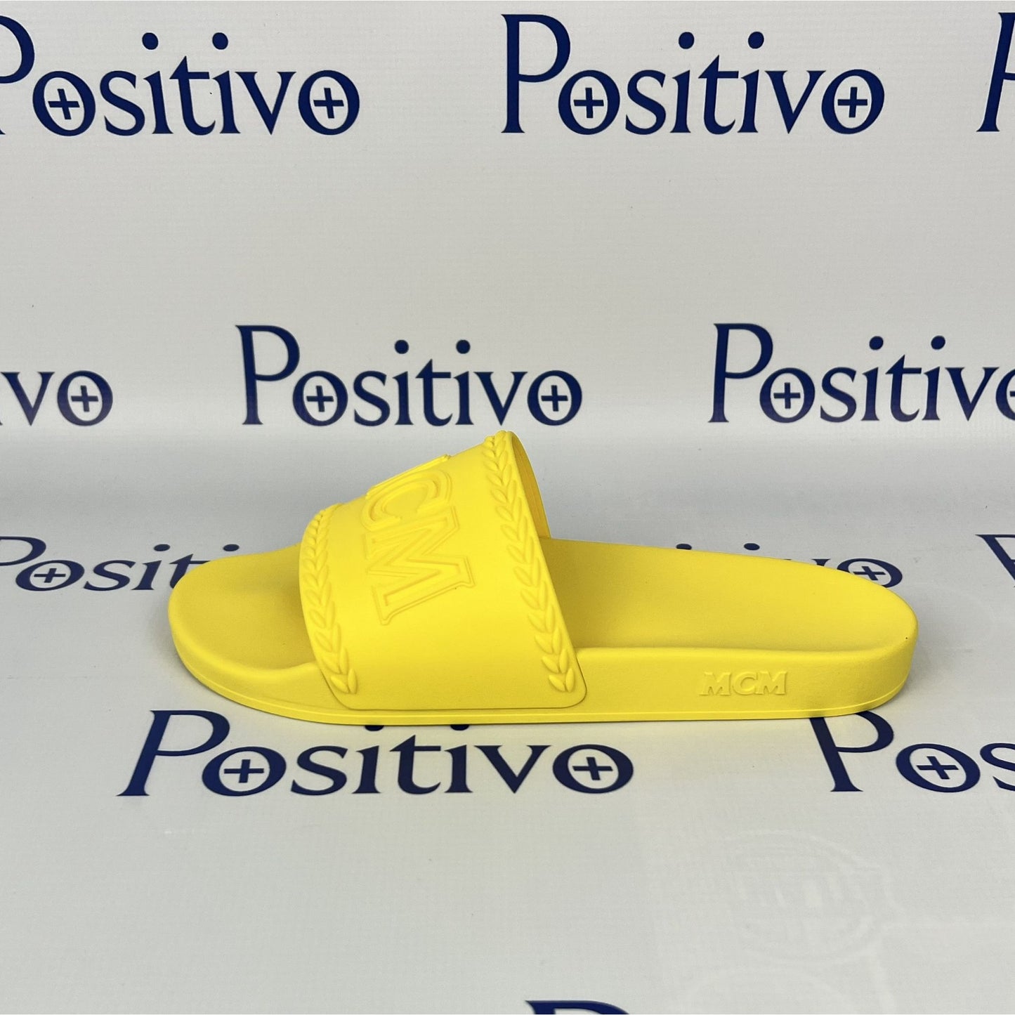 MCM Womens Yellow Big Logo Rubber Slides | Positivo Clothing