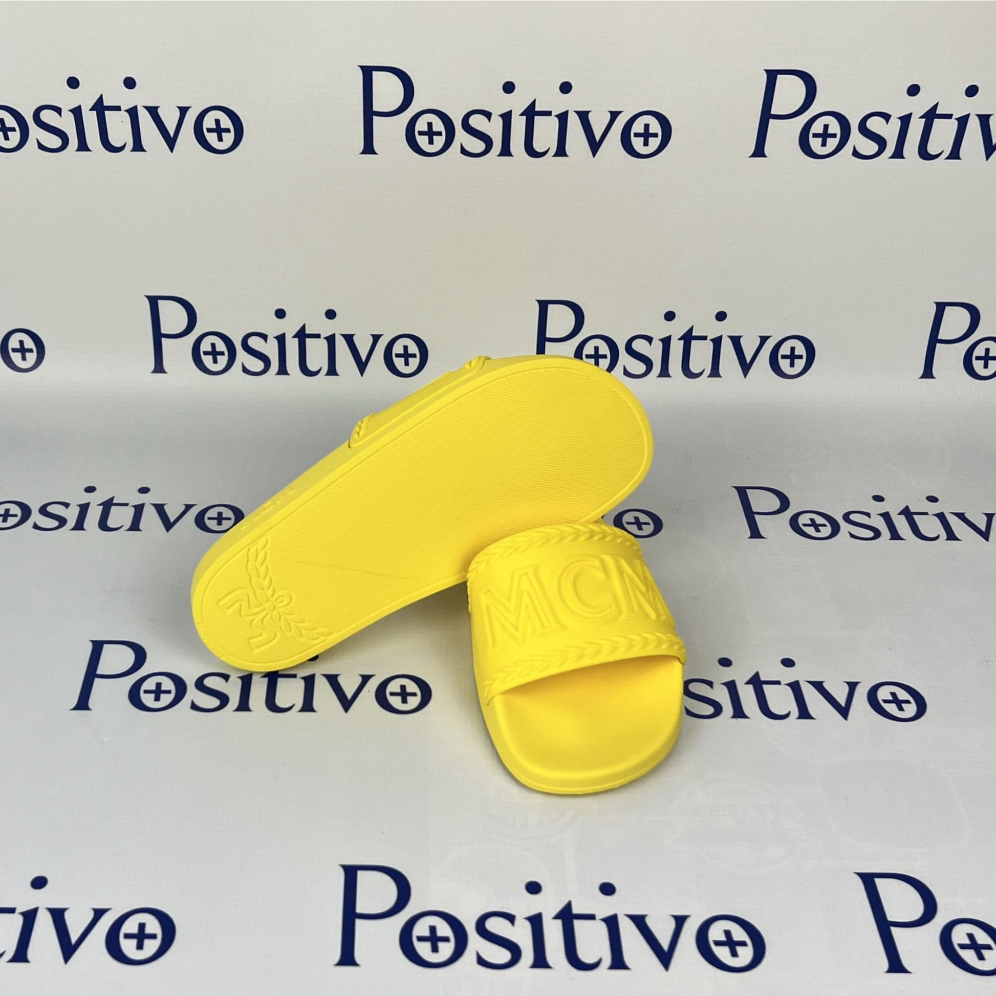 MCM Womens Yellow Big Logo Rubber Slides | Positivo Clothing