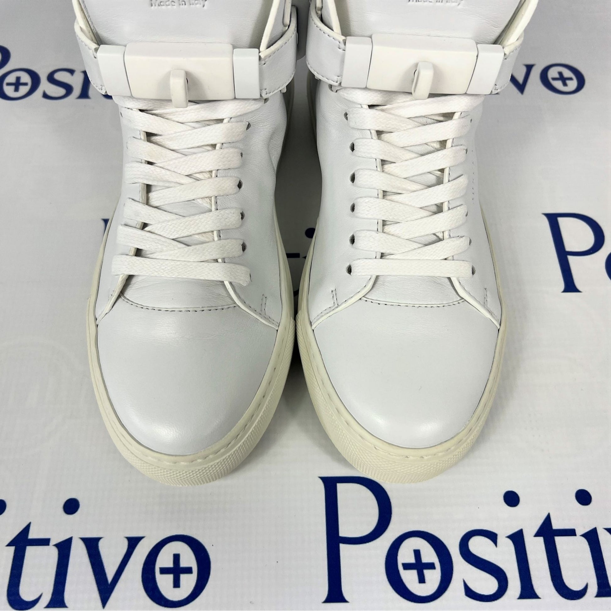 Buscemi Womens 100MM Flat Tonal White Leather Sneakers | Positivo Clothing